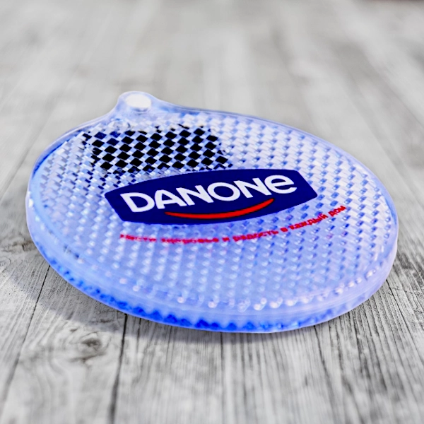 Нанесение логотипа компании DANON на светоотражателях