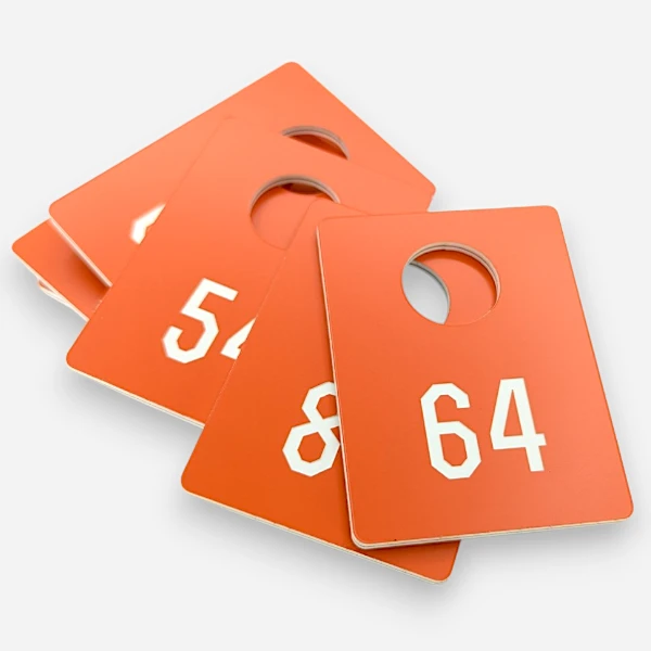 Номерки в гардероб из двухслойного пластика с гравировкой